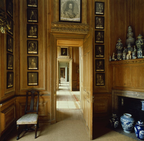 A view through the State Dressing Room at Beningbrough Hall showing an enfilade of doors through to other rooms