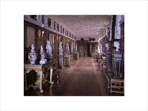 View of the Long Gallery at Powis Castle showing the full length of the gallery and plasterwork ceiling