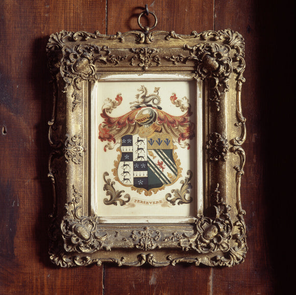 A framed drawing of the Potter coat of arms hangs to the left of the Parlour window at Hill Top