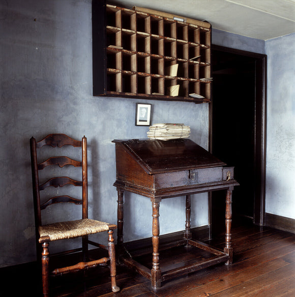 The pigeon-hole sorting rack on the wall in the entrance room of the former offices of W.H.Heelis and Son in Hawkshead, now part of the Beatrix Potter gallery