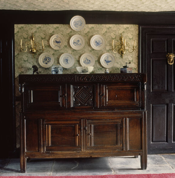 A local carved oak press cupboard at Hill Top, bought by Beatrix at a local farm sale