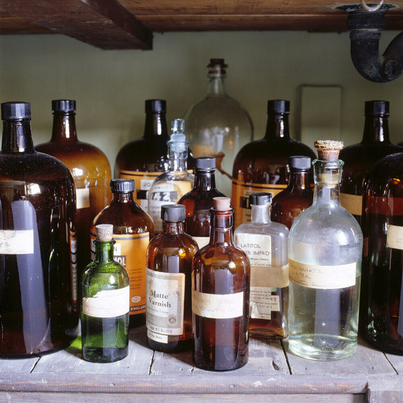 The Dark Room at 59 Rodney Street, Liverpool, the E. Chambre Hardman Studio, House and Photographic Collection - showing a close view of bottles of chemicals.