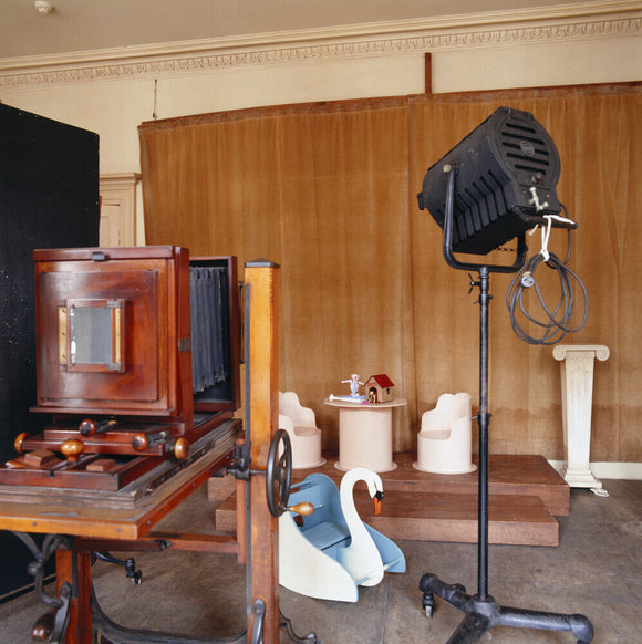 The Studio at 59 Rodney Street, Liverpool, the E. Chambre Hardman Studio, House and Photographic Collection - showing a large format camera, lights and a childrens background.