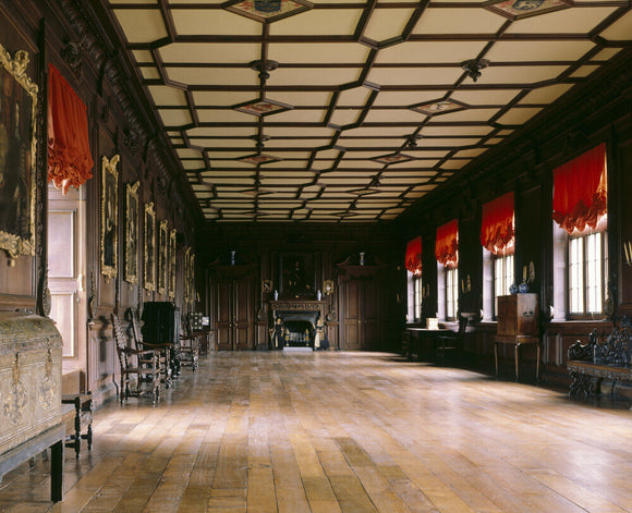 View of the Long Gallery at Chirk Castle showing the carved woodwork and panelled ceiling