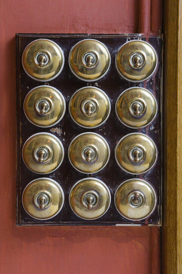 Brass light switches on the Staircase at Hughenden Manor, Buckinghamsh ...
