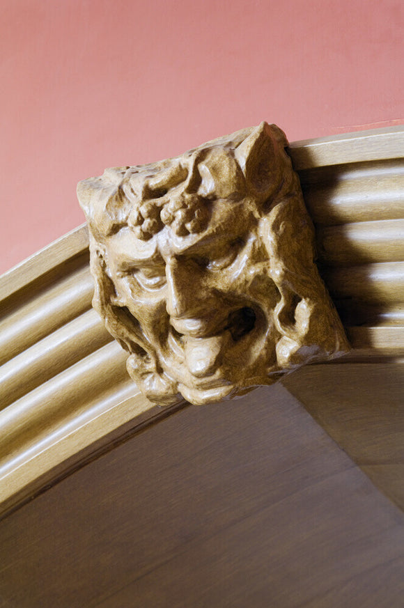 Carved wooden overdoor mask in the Garden Hall at Hughenden Manor, Buckinghamshire