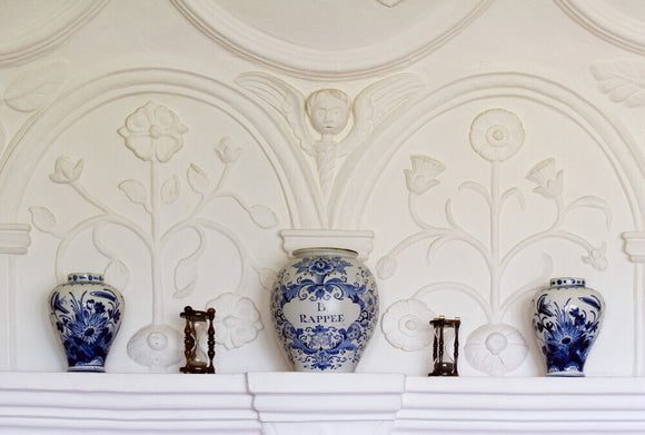 Blue and white ceramics on display against the plasterwork overmantle of the Music Room at Westwood Manor, near Bradford-on-Avon, Wiltshire