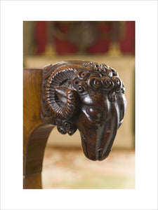Detail of a carved wooden ram's head on an armchair in the Sitting Room at Hinton Ampner, Hampshire
