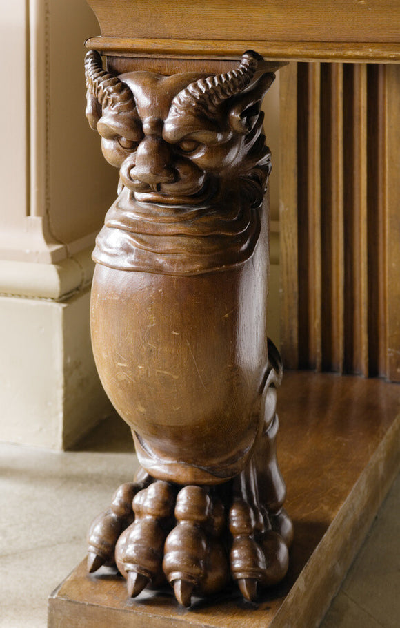 Detail of carved wooden table leg depicting a mythical creature with splayed toes, in the Entrance Hall at Ickworth, Suffolk