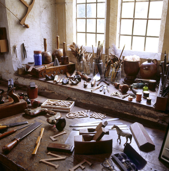Partial view of the workshop bench in the Priest's House at Snowshill containing woodworking tools used by Charles Wade