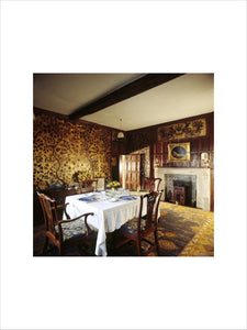 The Dining Room with the table set for a meal and showing the Cordoba wall covering