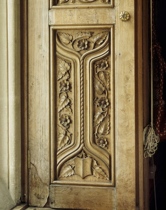 Detail of the shutters in the Drawing Room, with carving by James Plucknett, at Tyntesfield