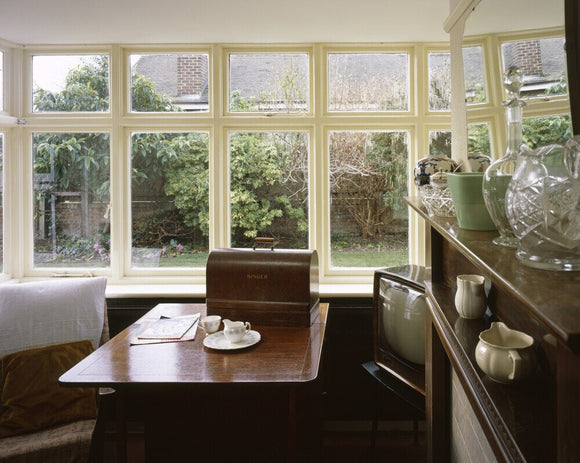 The Morning Room at Mendips, looking towards the windows, showing the sewing machine and 1960s television set