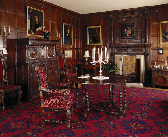 Room view of the Drawing Room looking towards the c17th chimney- piece, fine court cupboard inlaid with bone and dated 1683, Victorian chairs richly carved in late c17th style