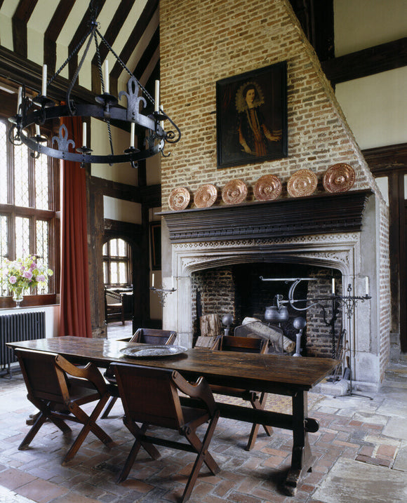 Towards fireplace, with spit and cauldron