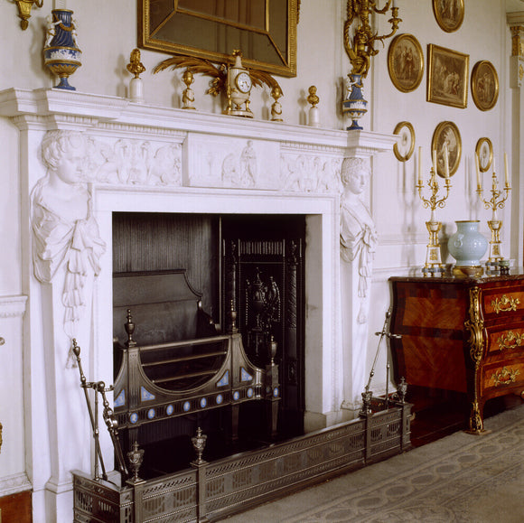 The carved Carrara marble fireplace in the Drawing Room