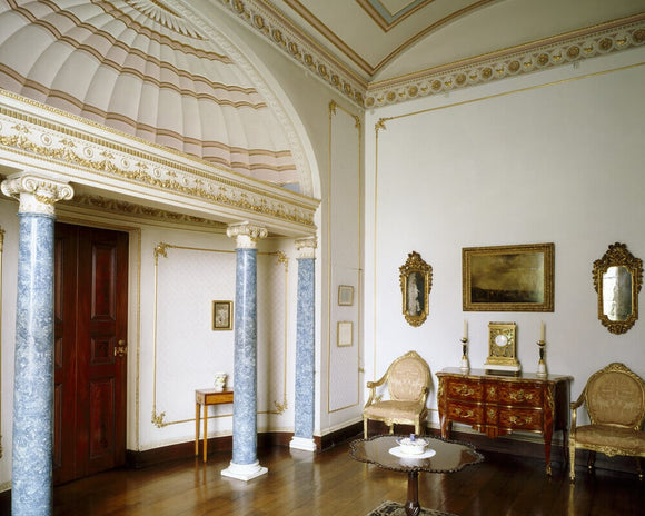 A corner of the Boudoir with the lapis blue scagliola columns, the fan-shaped semi-dome and furniture from the Digby collection