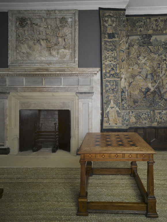 A marquetry topped games table, English c.1580, in the Withdrawing Chamber at Hardwick Hall, Derbyshire.