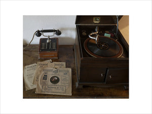 A telephone, gramophone and collection of 78rpm records in the Butler's Sitting Room at Castle Drogo, Devon