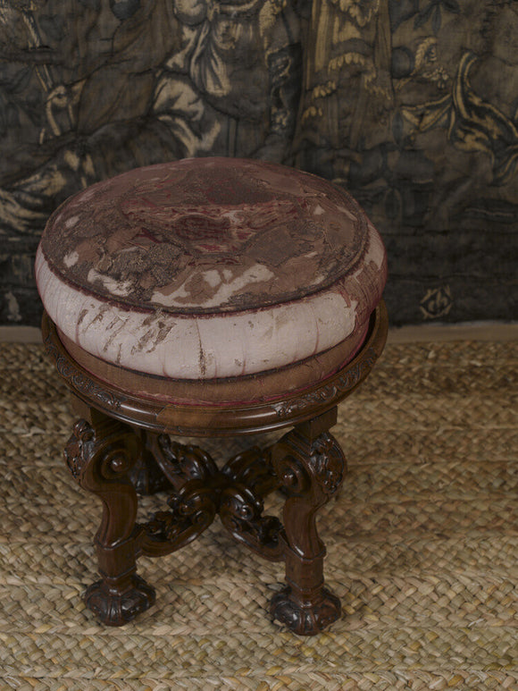 A giltwood stool, c.1685, part of a set of furniture made about 1700 for the Queen of Scots' apartment at Chatsworth, in the Gallery at Hardwick Hall, Derbyshire.