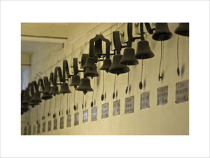 Long line of servants bells in the corridor next to the Still Room at Dunham Massey, Cheshire